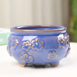 Maceta redonda con relieve de flor 8x6.5cm
